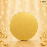 Gold circular object on a beige background with decorative elements