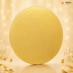 Gold round cake board with decorative elements on a beige background