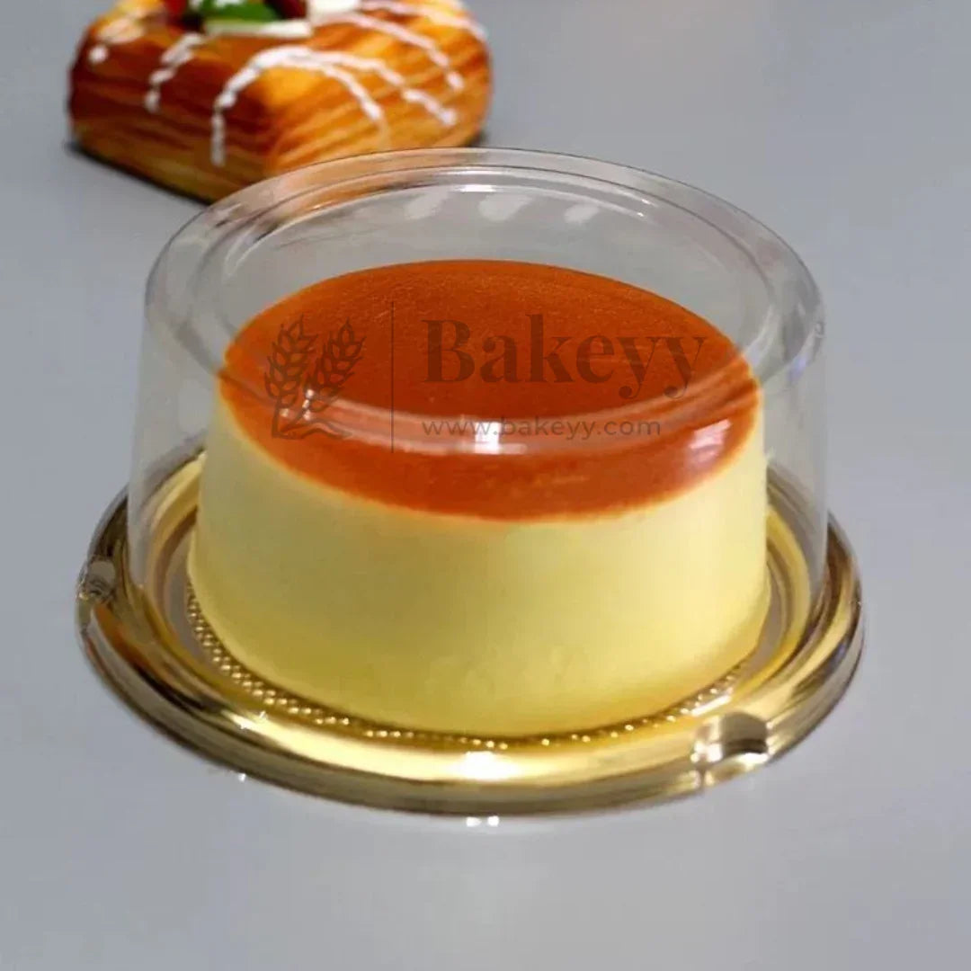 Custard dessert in a clear dome with 'Bakeyy' branding on a gray background
