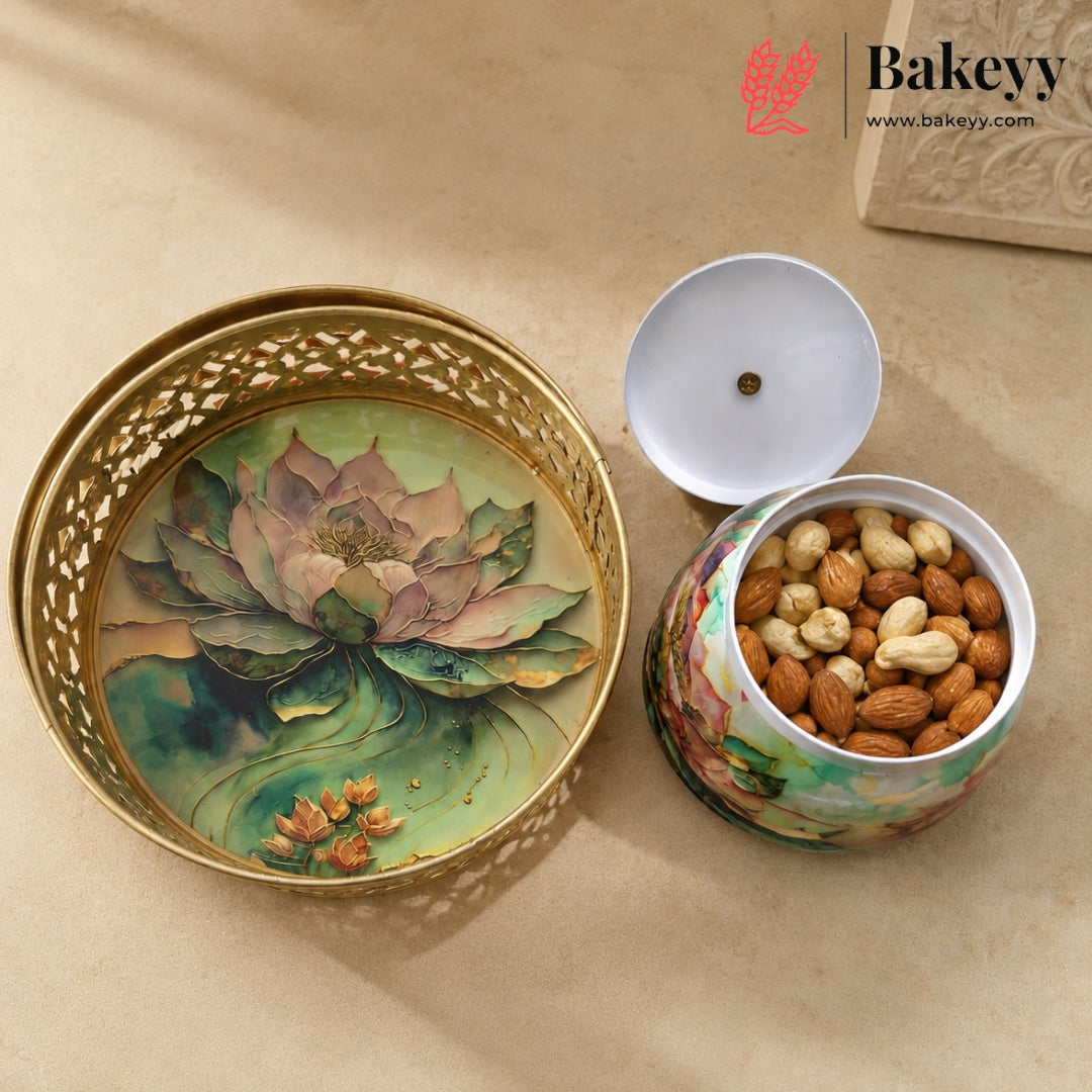 A decorative ceramic nut and candy jar with a matching lid, shown open with almonds inside. The jar has a floral lotus design in soft green, pink, and gold tones, with a gold-tone perforated rim.