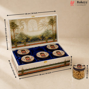 An open decorative gift box containing four small round jars of nuts, shown with dimension arrows and labels indicating 36 cm by 25.5 cm.