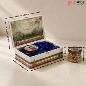 A decorative rectangular gift box with a tropical landscape print on the lid and sides, lined with blue velvet, shown open with dimension arrows and labels indicating 24 cm by 16.5 cm by 9 cm.