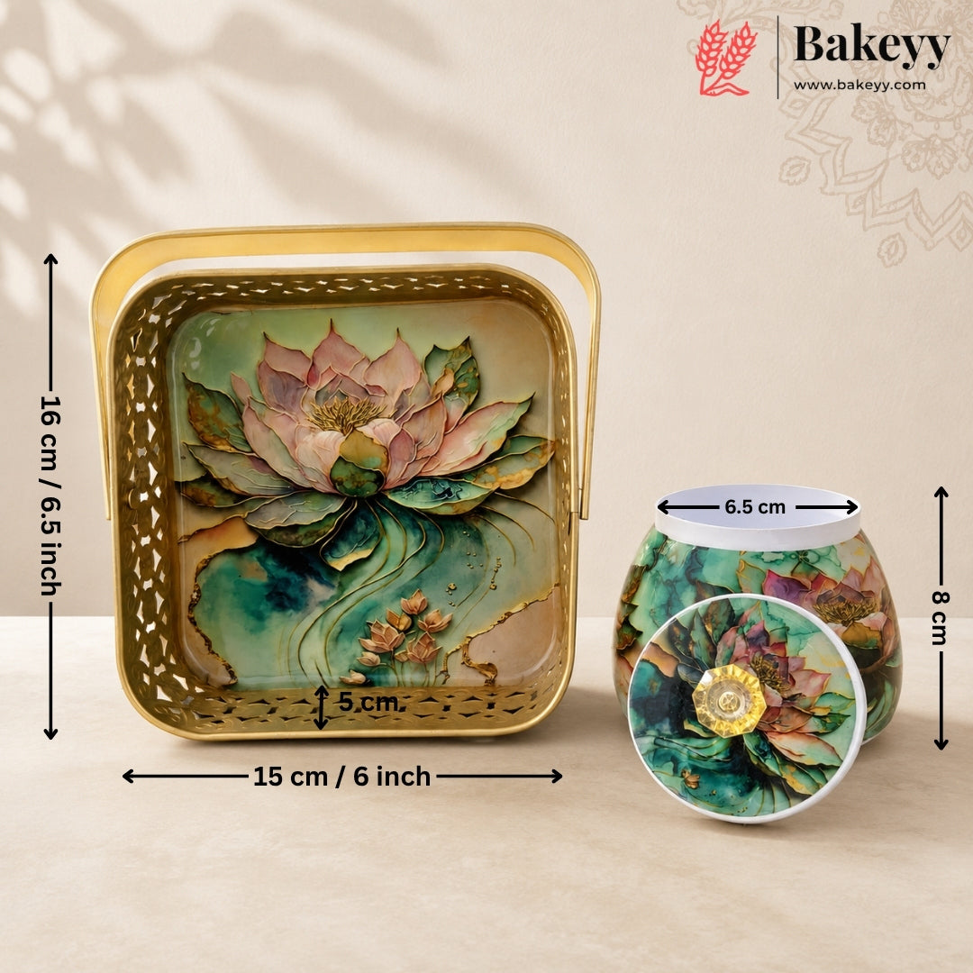 Decorative square metal cake pan with a floral lotus design, shown alongside a matching round candle holder and a circular inset detail. Black dimension lines and text indicate measurements of 16 cm height, 15 cm base, and 6.