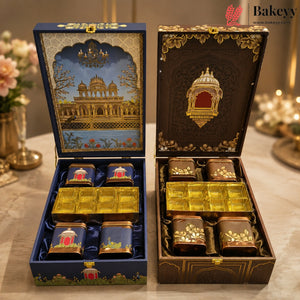 Two ornate gift boxes for tea or spices are shown open on a table. The left box is navy blue with gold detailing and an illustrated palace scene on the lid, containing four small blue containers and a gold tray.