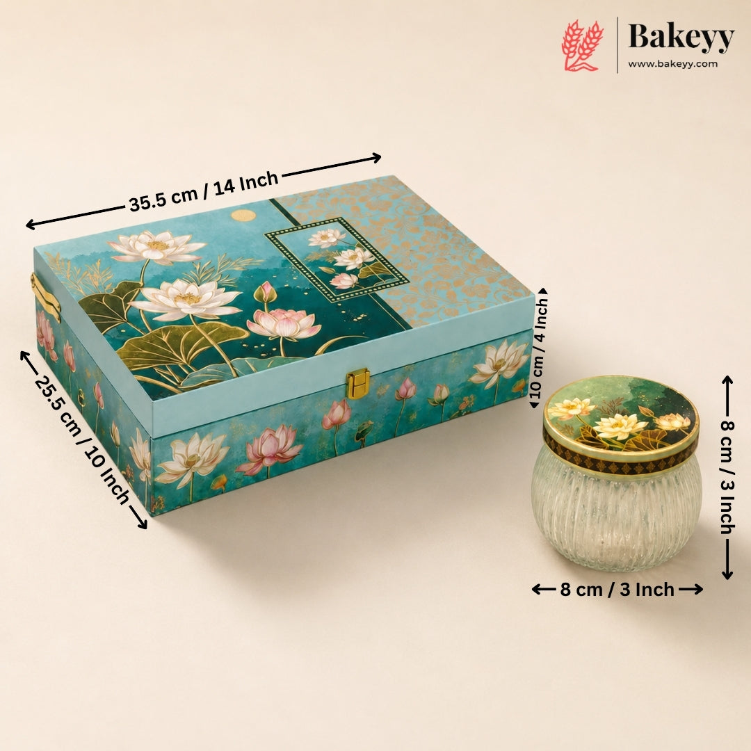 Decorative rectangular storage box with a lily pond print, shown alongside a small ribbed glass jar. The image includes dimension arrows and labels for both items and the Bakeyy brand logo in the top right corner.