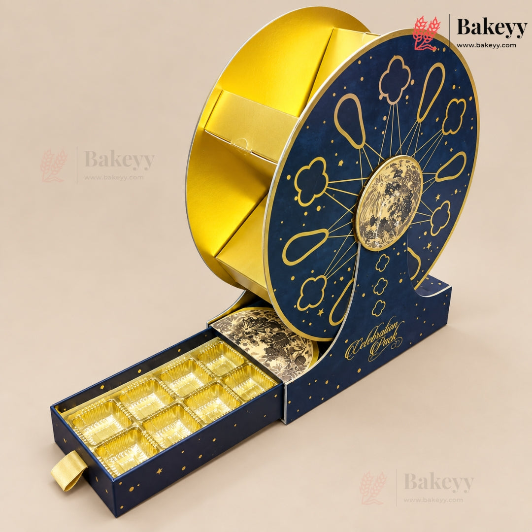 A luxury chocolate gift box set featuring a large spiral wheel design in navy blue and gold, with an open drawer below containing multiple gold foil-lined chocolate compartments. The brand name 'Bakeey' is visible in the top right corner.