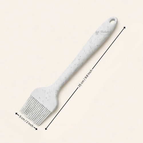 White silicone baking brush 25cm, 5cm wide, ideal for pastry and bakery use from Bakeyy.com