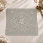 Gray baking mat with measurement markings on a light surface, featuring the Bakey brand.