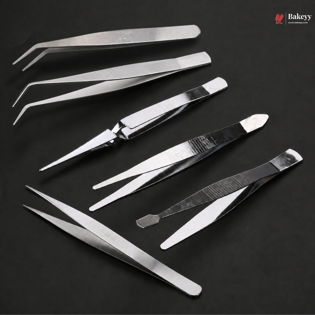 Set of metal tweezers on a dark background with 'Bakey' branding.
