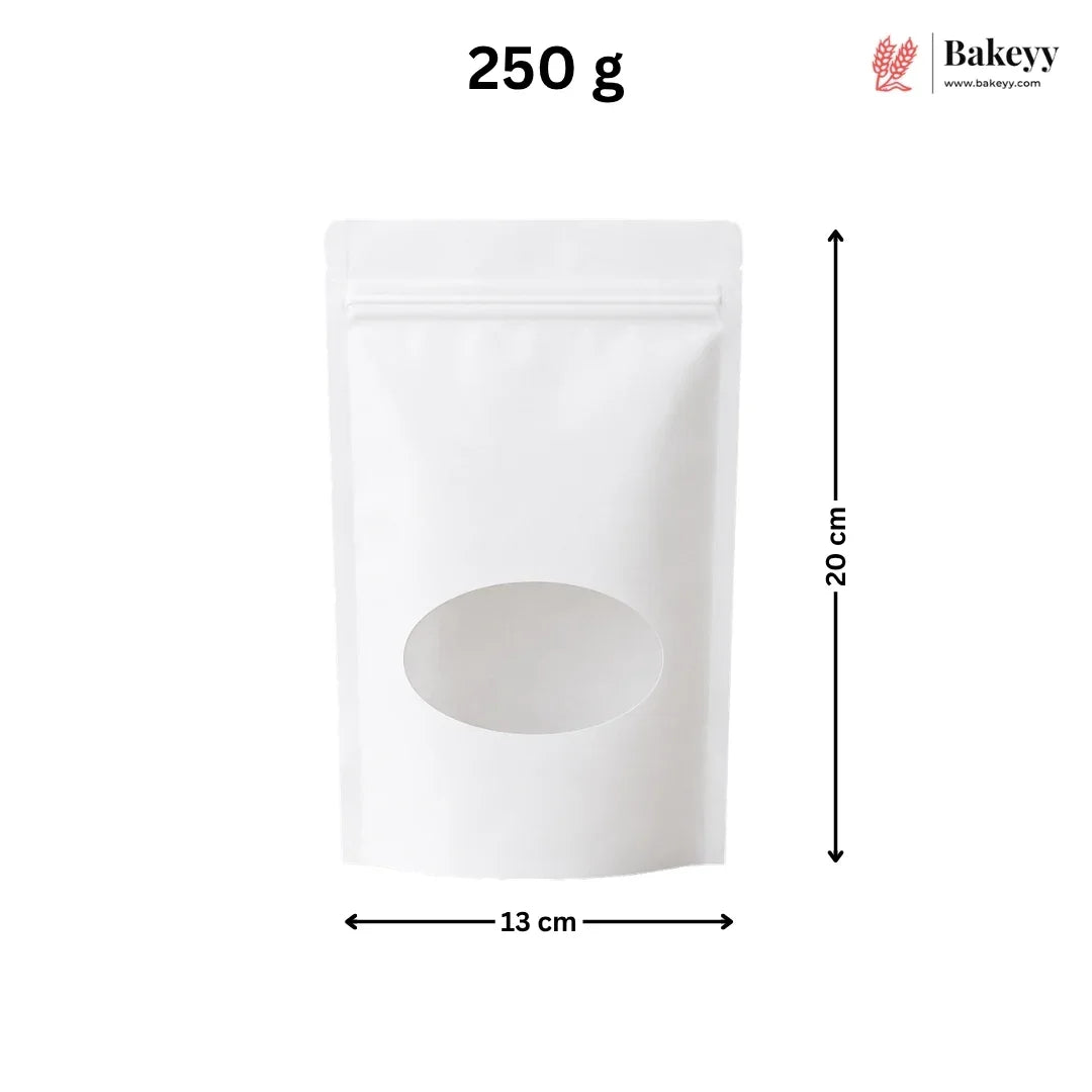 A white stand-up pouch bag with a zipper closure and a large oval window on the front, shown with dimension arrows indicating 15 cm width and 22 cm height. The text '200 g' appears at the top, and the Bakeey logo is in the upper right corner.