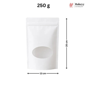 A white stand-up pouch bag with a zipper closure and a large oval window on the front, shown with dimension arrows indicating 15 cm width and 22 cm height. The text '200 g' appears at the top, and the Bakeey logo is in the upper right corner.