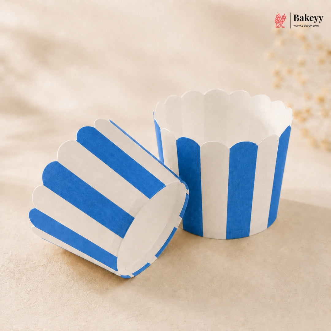 Blue and white striped cupcake liners on a beige background