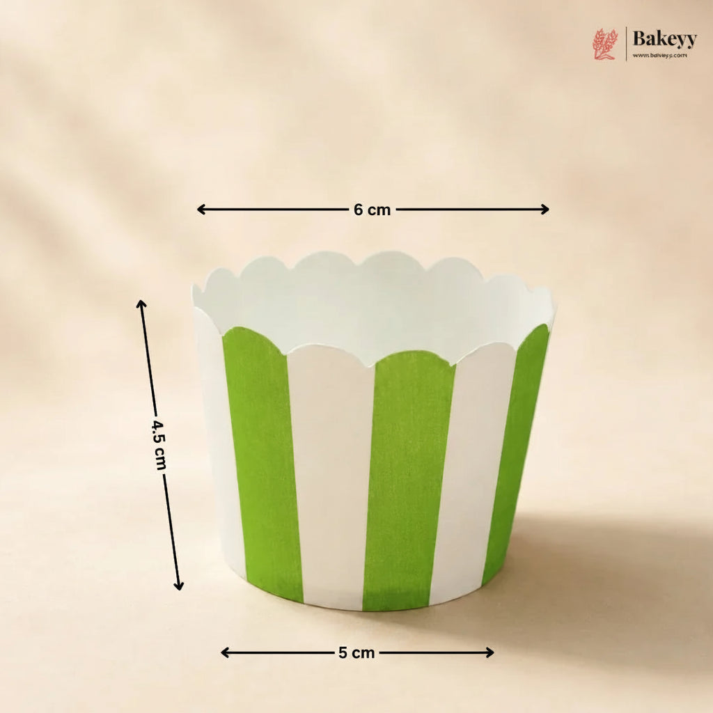 Green and white striped cupcake liner with measurements on a beige background, branded 'Bakeyy'.