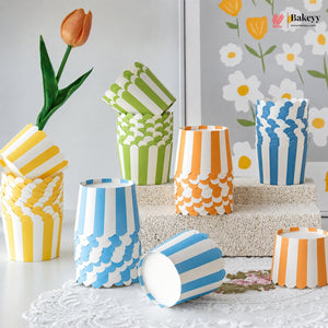 Colorful paper cups with patterns on a decorative surface