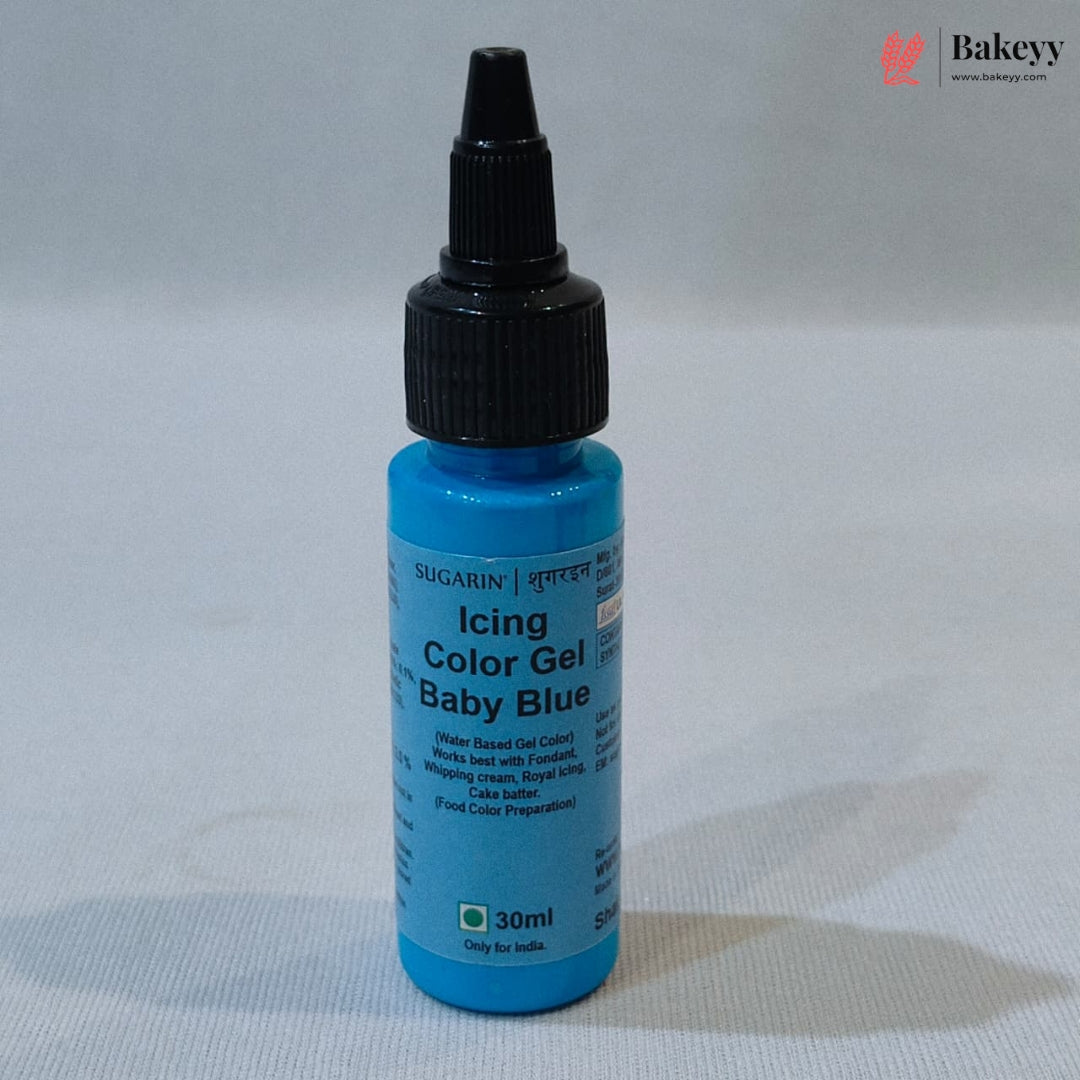 A 30ml bottle of Sugarin Baby Blue Icing Color Gel with a black cap, set against a neutral light gray background.