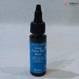 A 30ml bottle of Sugarin Icing Color Gel in the shade Blue, featuring a black dropper cap and a blue label, set against a neutral gray background.