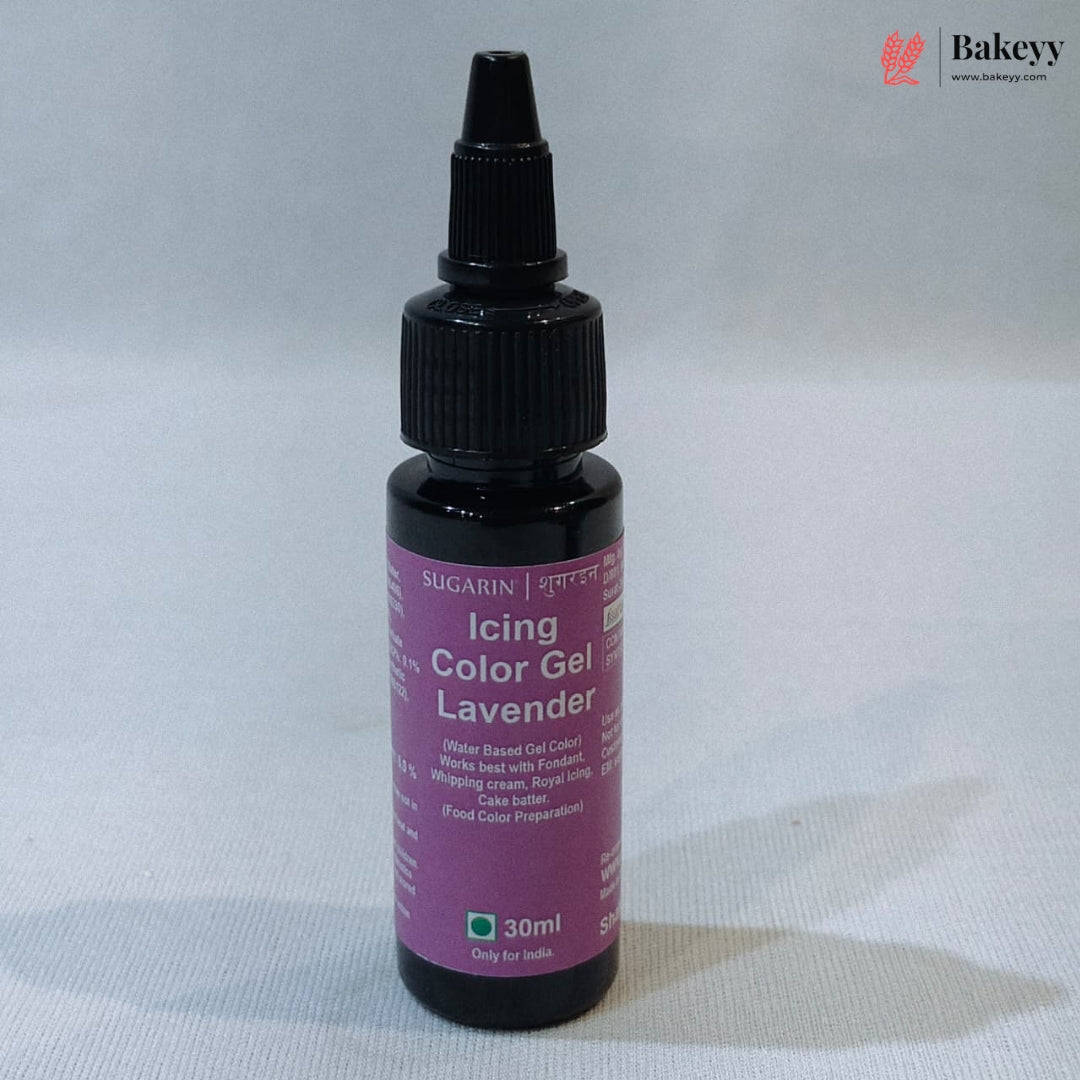 A 30ml bottle of Sugarin Lavender Icing Color Gel with a purple label and black dropper cap, set against a light gray fabric background.