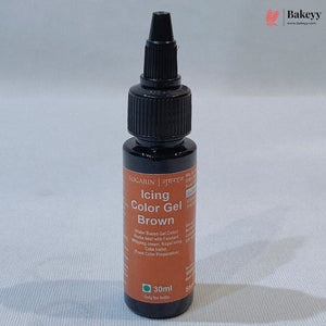 A 30ml bottle of Sugarn Icing Color Gel Brown, featuring a black plastic dropper cap and a terracotta-colored label, set against a light gray fabric background.
