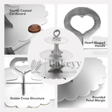 Bakeyy product with heart-shaped handle, sturdily coated cardboard, stable cross structure, and rounded petal margin on a white background.