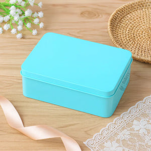 Bakeyy blue tin box for bakery gift packaging on wooden table with ribbon and lace