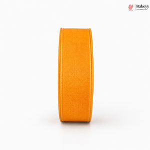Orange ribbon roll on a white background with 'Bakeyy' branding.