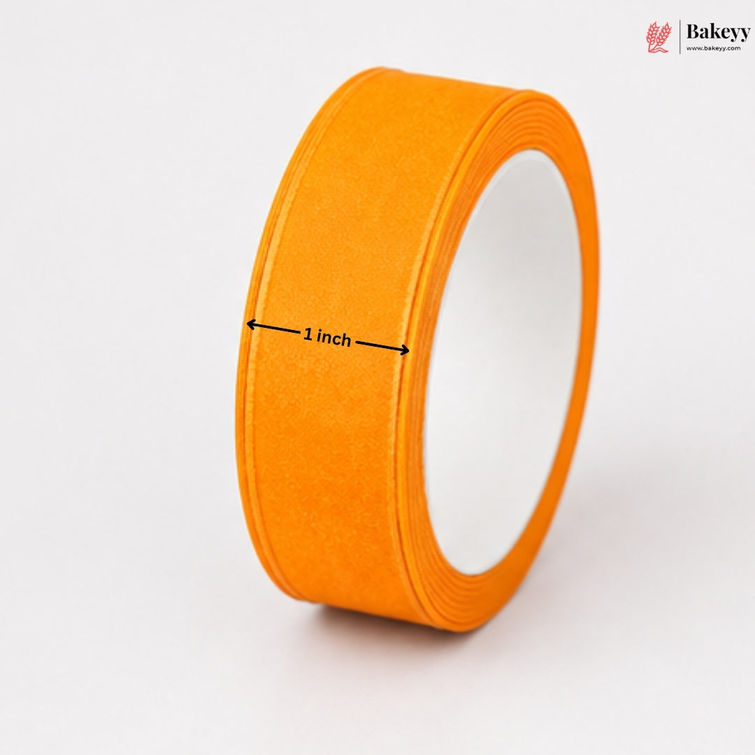 Orange tape roll with a measurement label on a white background