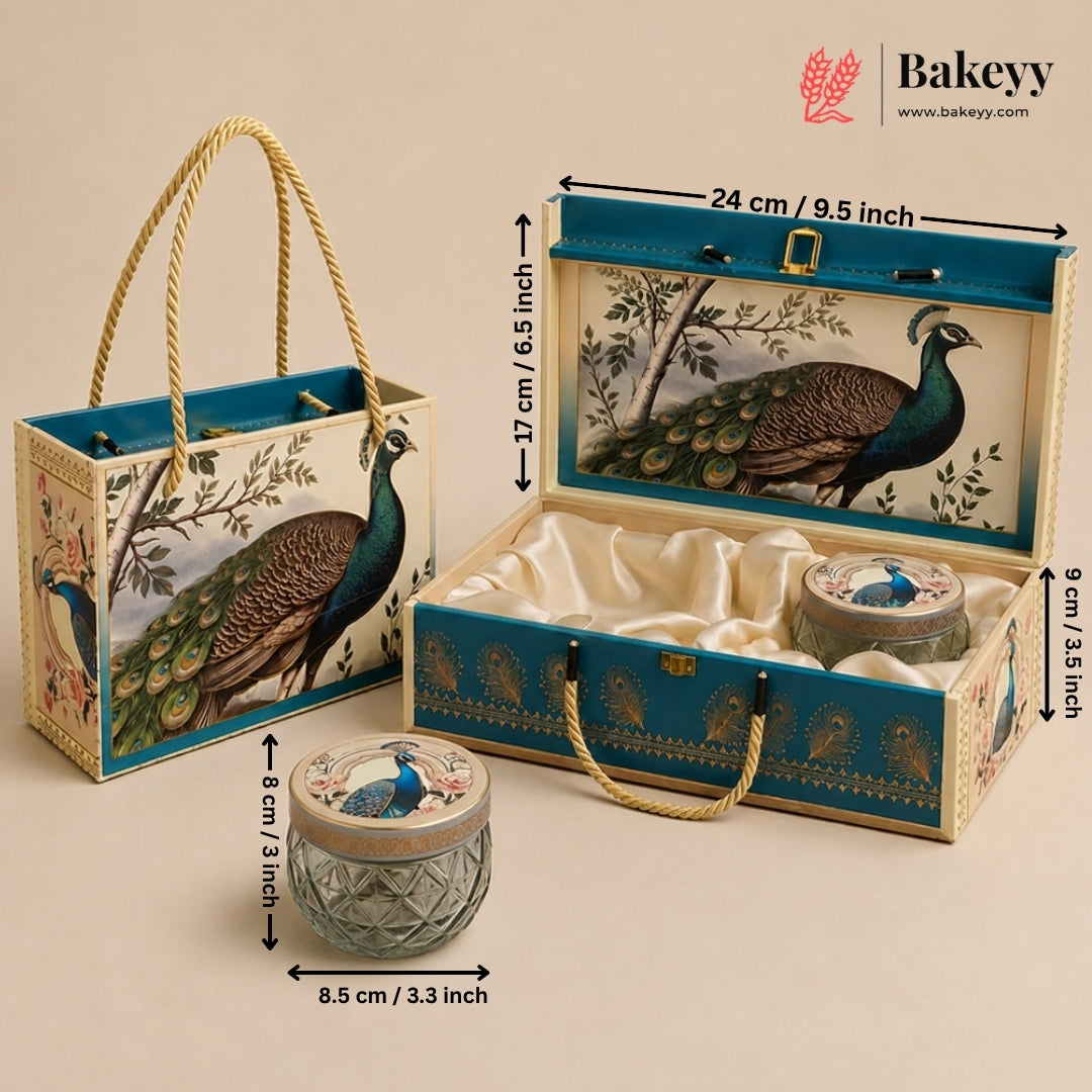 A Bakeyy peacock-themed gift set shown with its decorative tote bag, open presentation box, and two small jars, with overlaid dimensions on a warm beige background.