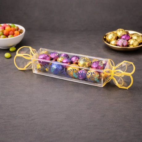 Clear transparent box with decorative floral print
Candy-style shape with twisted ends for a gift-ready look
Ideal for chocolates, candies, toffees, small treats, and favors
Great for birthdays, weddings, baby showers, festive gifting, and hampers
Lightweight, neat presentation, easy to display