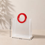 White bag with a red handle and measurements on a beige background