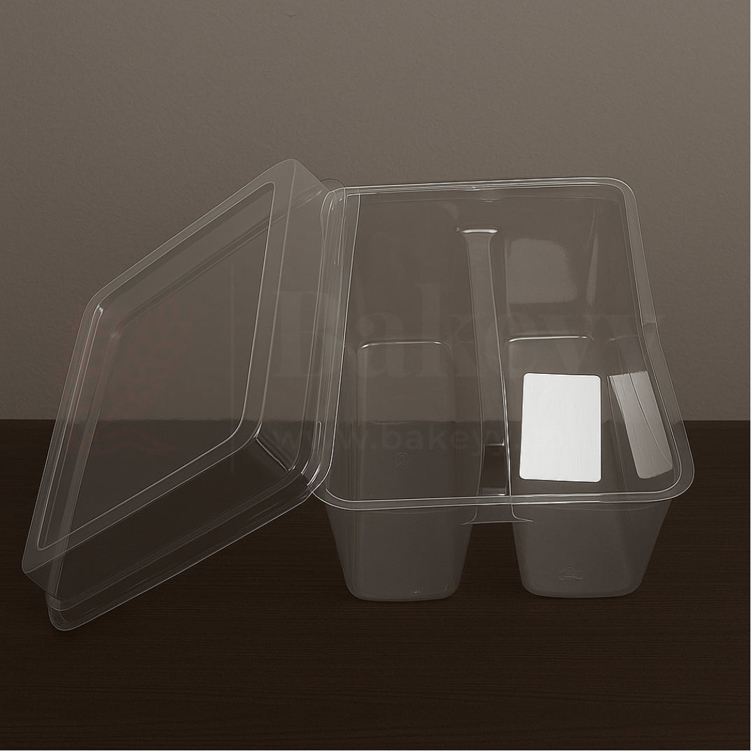 Clear plastic container with compartments on a dark surface