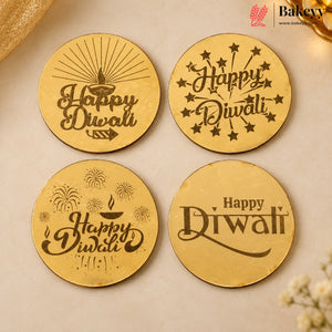 Four round gold-colored Diwali-themed engraved coasters or placemats arranged in a 2x2 grid on a beige surface. The designs include a diya, stars, fireworks, and the words 'Happy Diwali' in dark brown lettering.