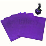 Purple wrapping sheets for bakery gift packaging from Bakeyy, shown with wrapped item