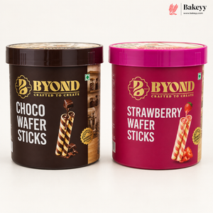 Two BYOND branded wafer stick tubs on a white background: Choco Wafer Sticks in a dark brown container and Strawberry Wafer Sticks in a magenta-pink container. The Bakeey website logo appears in the top right corner.