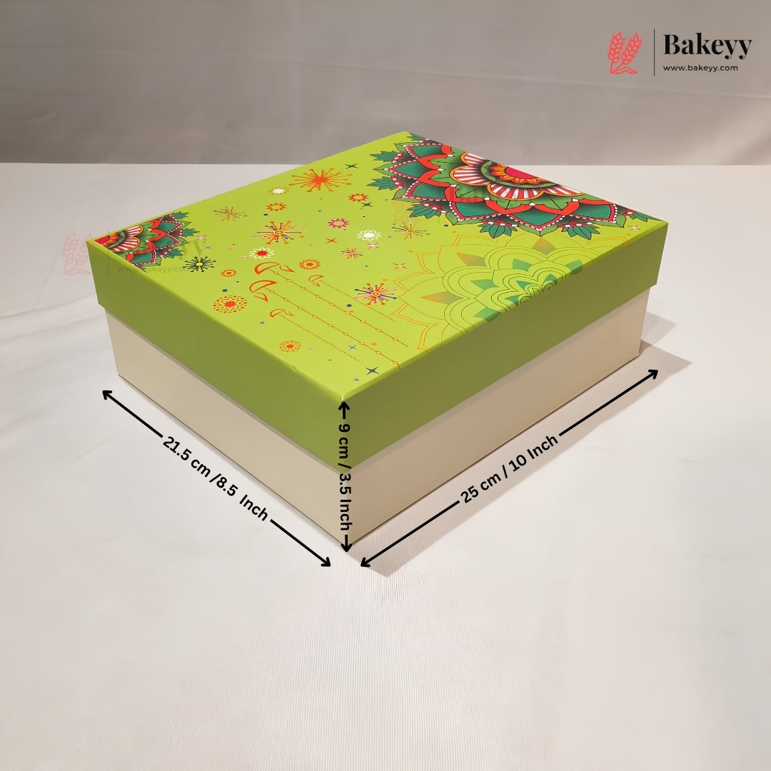 A square bakery gift box with a bright lime green lid featuring a colorful mandala and floral pattern, and a solid light beige base. Black dimension arrows and text overlay show the measurements: 25 cm / 20 inch length, 21.