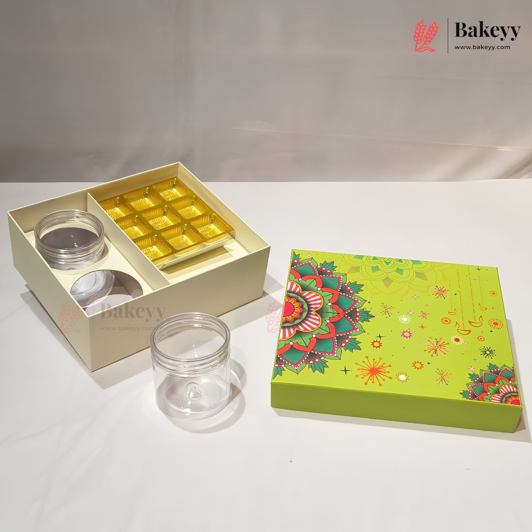 A bakery gift set display featuring an open cream-colored box with two clear glass jars and a tray of gold square chocolates, alongside a closed lime green decorative box with a mandala pattern. The Bakeyy brand logo is visible in the top right corner.