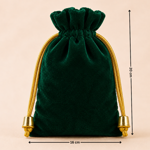 Green velvet drawstring bag with gold accents and measurements on a beige background