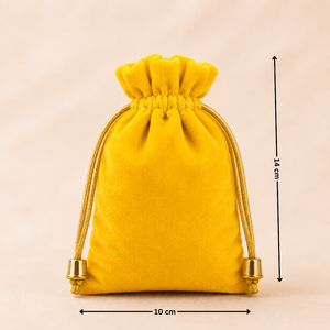 Yellow velvet drawstring bag with measurements on a beige background
