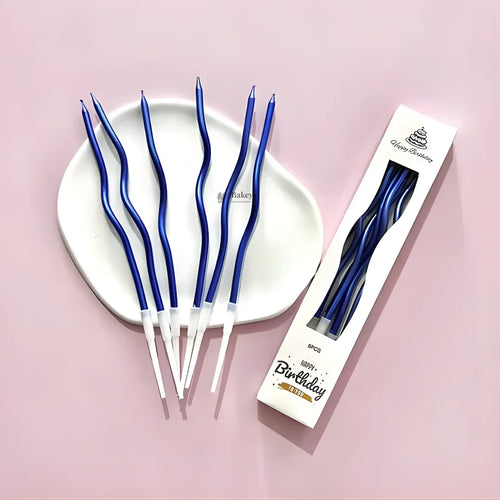 Blue wavy spiral birthday cake candles with holders on a white plate, Bakeyy baking supplies