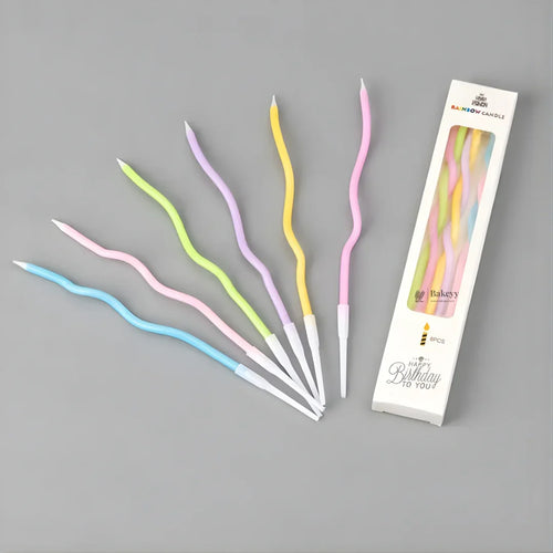 Wavy spiral birthday cake candles in pastel colors with holders, Bakeyy.com packaging.