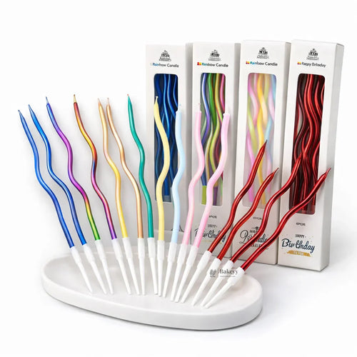 Colorful wavy spiral birthday cake candles with holders, displayed on white tray, Bakeyy.com