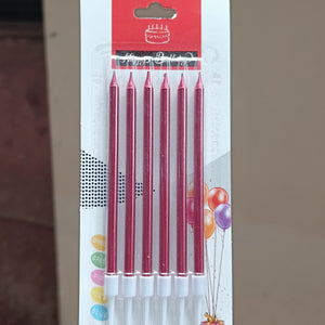 Pack of six birthday candles in a red metallic finish, sealed in a clear plastic sleeve and attached to a white cardboard backing with a red header card.
