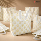 White tote bags with gold patterns on a beige background, featuring the Bakey brand.
