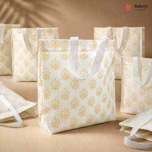 White tote bags with gold patterns on a beige background, featuring the Bakey brand.