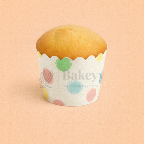 Muffin in a colorful paper cup with 'Bakeyy' branding on a peach background