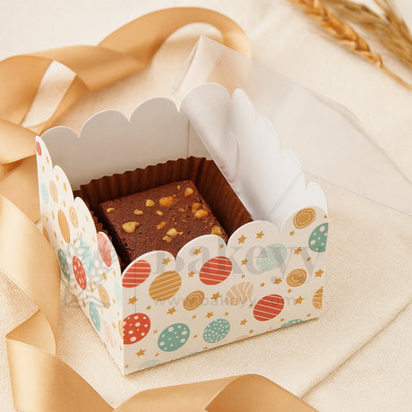 Decorative box with brownies inside on a light background