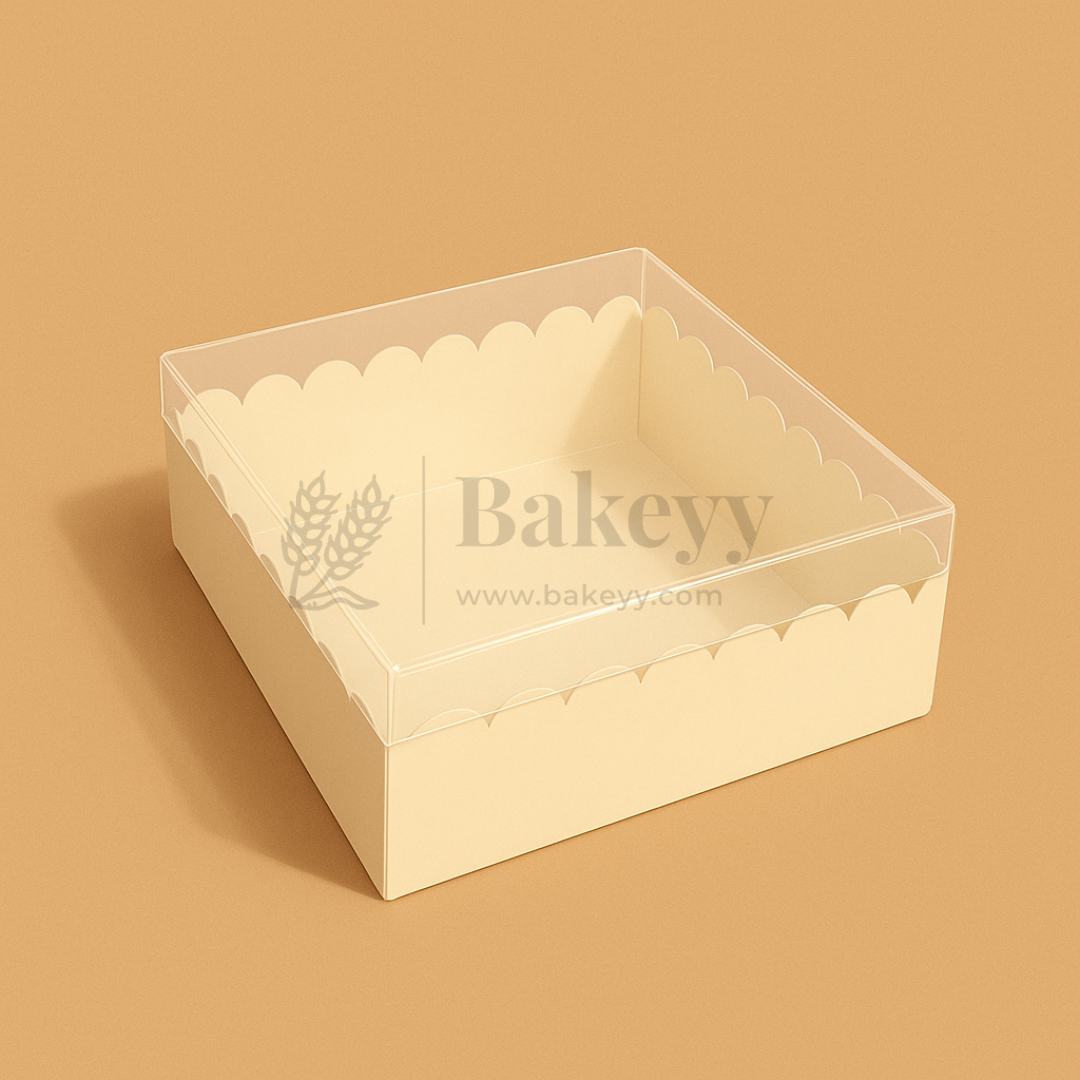 Beige cake box with scalloped edges and 'Bakeyy' branding on a beige background