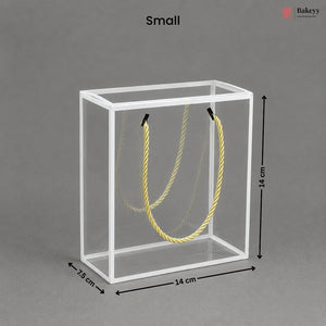 Small clear cube with yellow rope inside, dimensions labeled, on a gray background