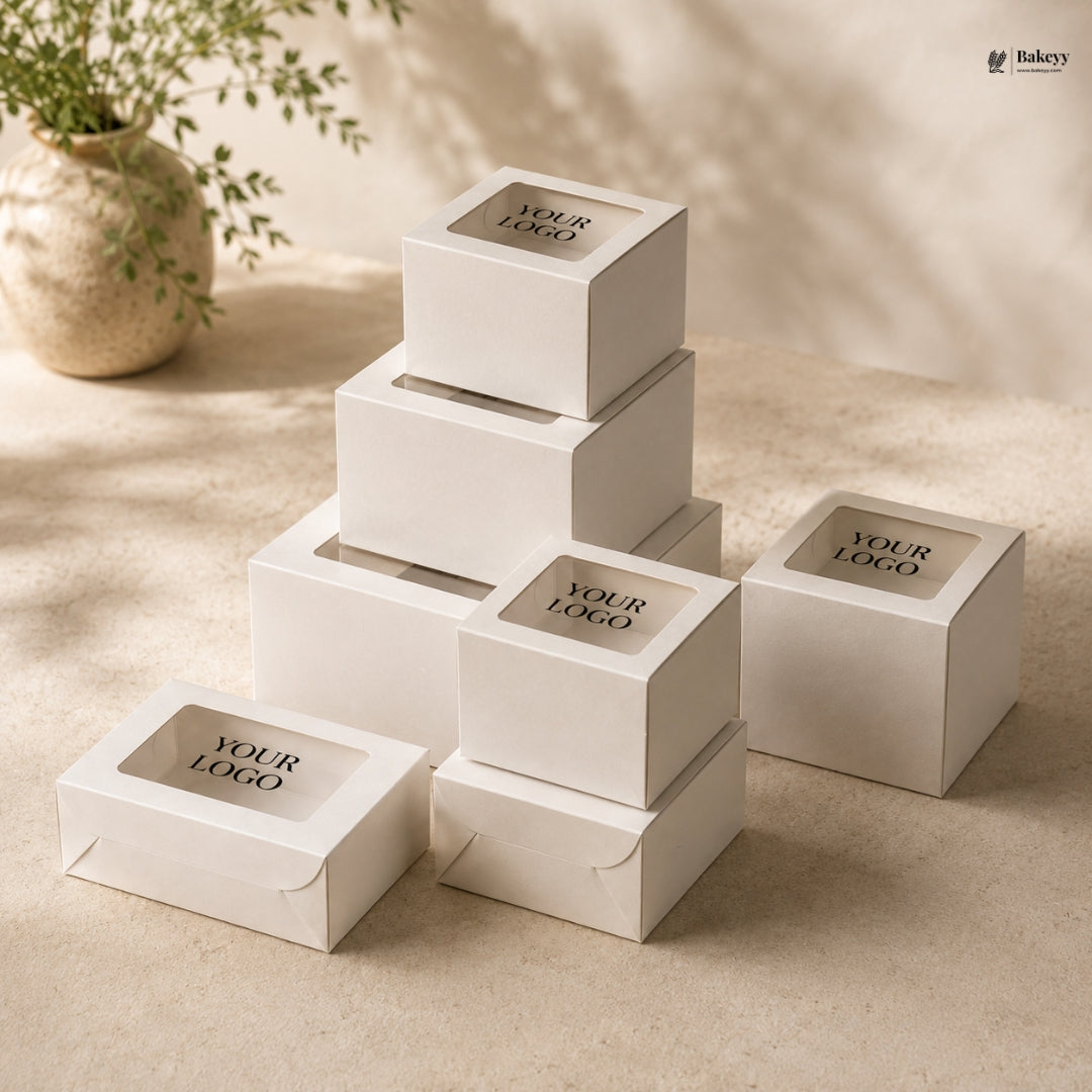 Stack of white boxes with 'Your Logo' text on a beige surface with a plant in the background