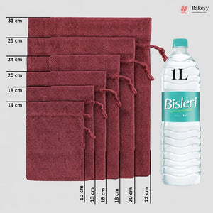 Six burgundy drawstring pouches of different sizes arranged in descending size order, with height measurements in centimeters labeled on the left and a 1L Bisleri water bottle shown on the right for scale. The Bakeyy logo is in the top right corner.