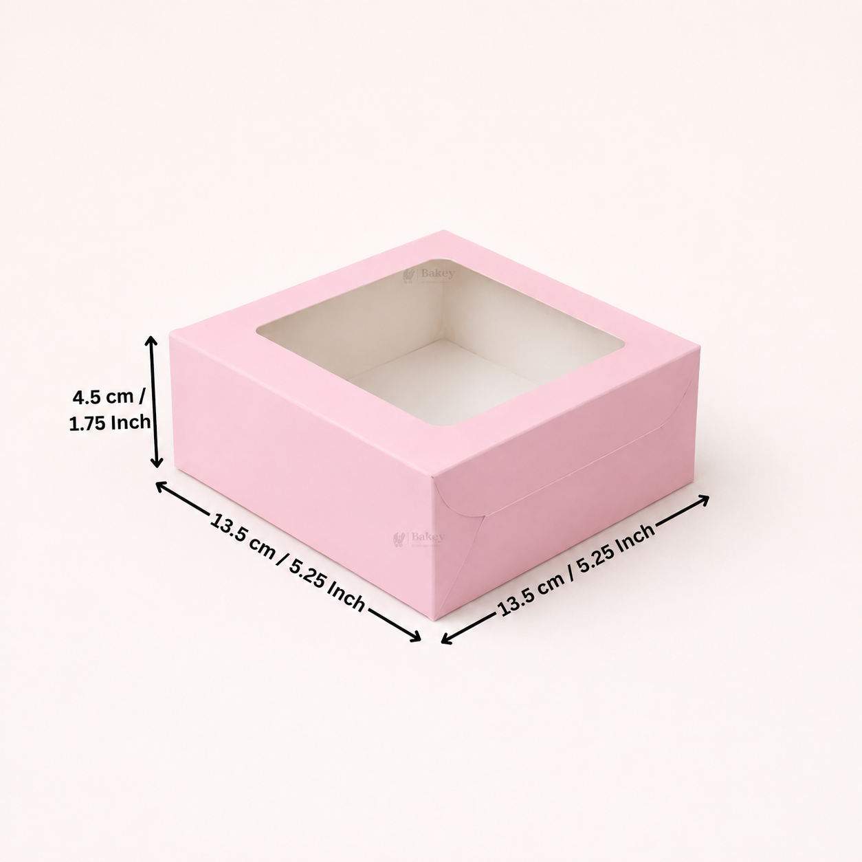 A pink square gift box with a clear window top, shown with dimension arrows and labels indicating 13.5 cm by 13.